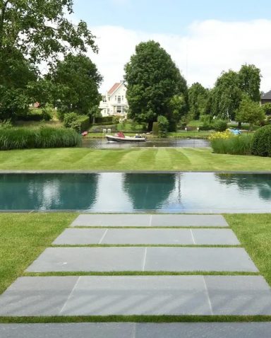 Skifferhäll Exklusiva naturstenshällar med generösa gräsfogar